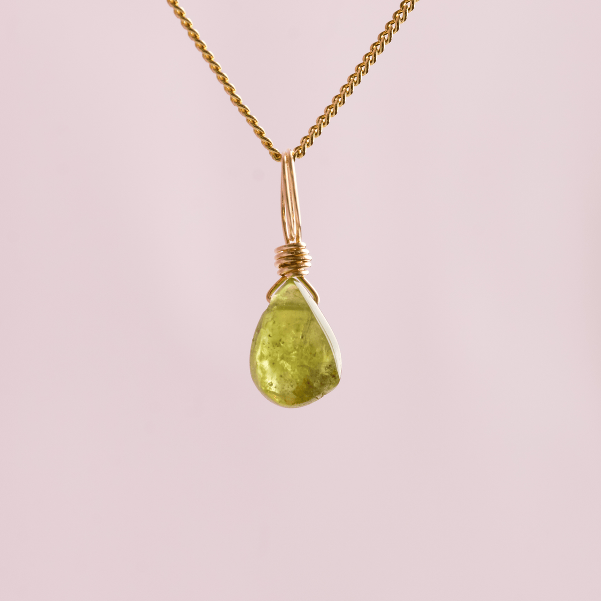 Peridot crystal charm droplet for abundance